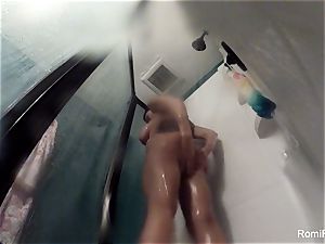 adult movie star Romi Rain brings her camera in the bathroom