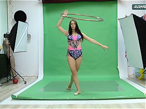 ample milk cans Nicole on the green screen stretching